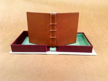 Leather binding and cloth clamshell